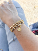 Pulseira fio de seda e medalha de São Bento