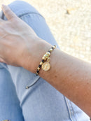 Pulseira fio de seda e medalha de São Bento